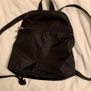 Lesportsac mini back pack in navy blue/black color